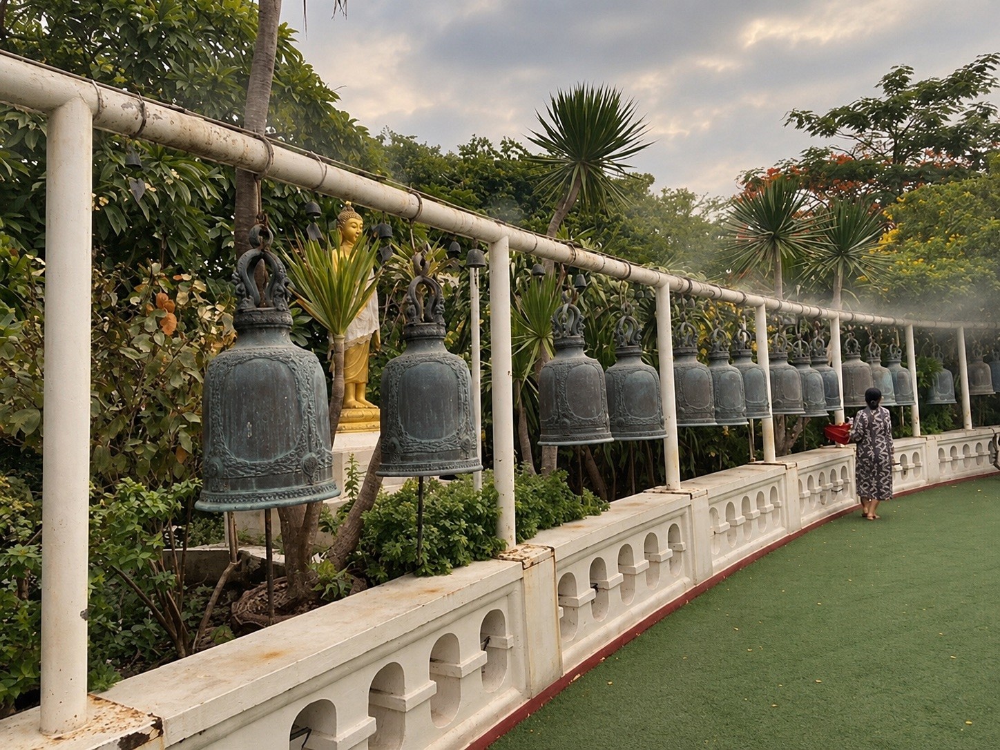 Row of temple bells along the walkway up the Golden Mount