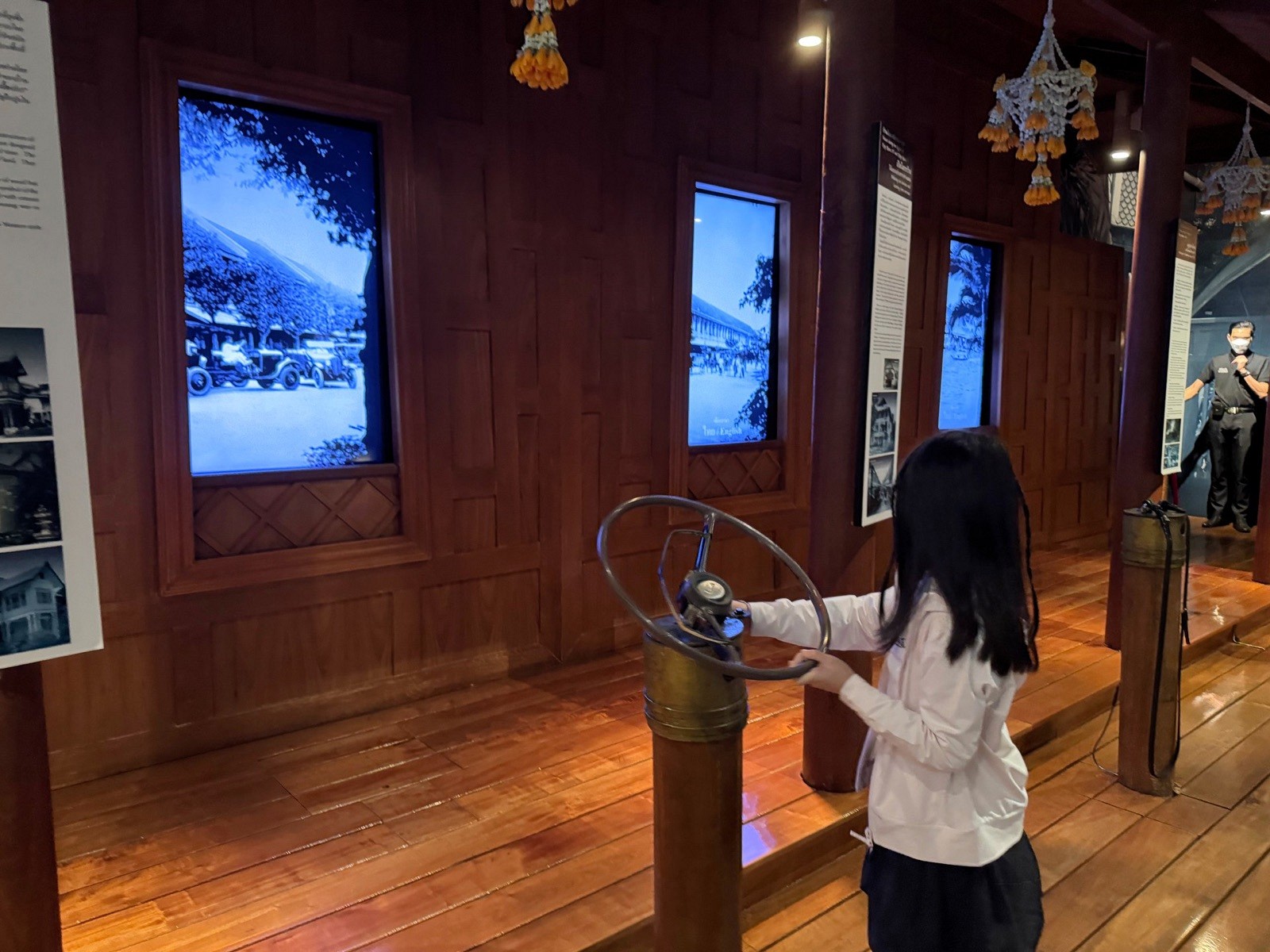Child at the wheel of the indoor boat journey at Rattanakosin Exhibition Hall