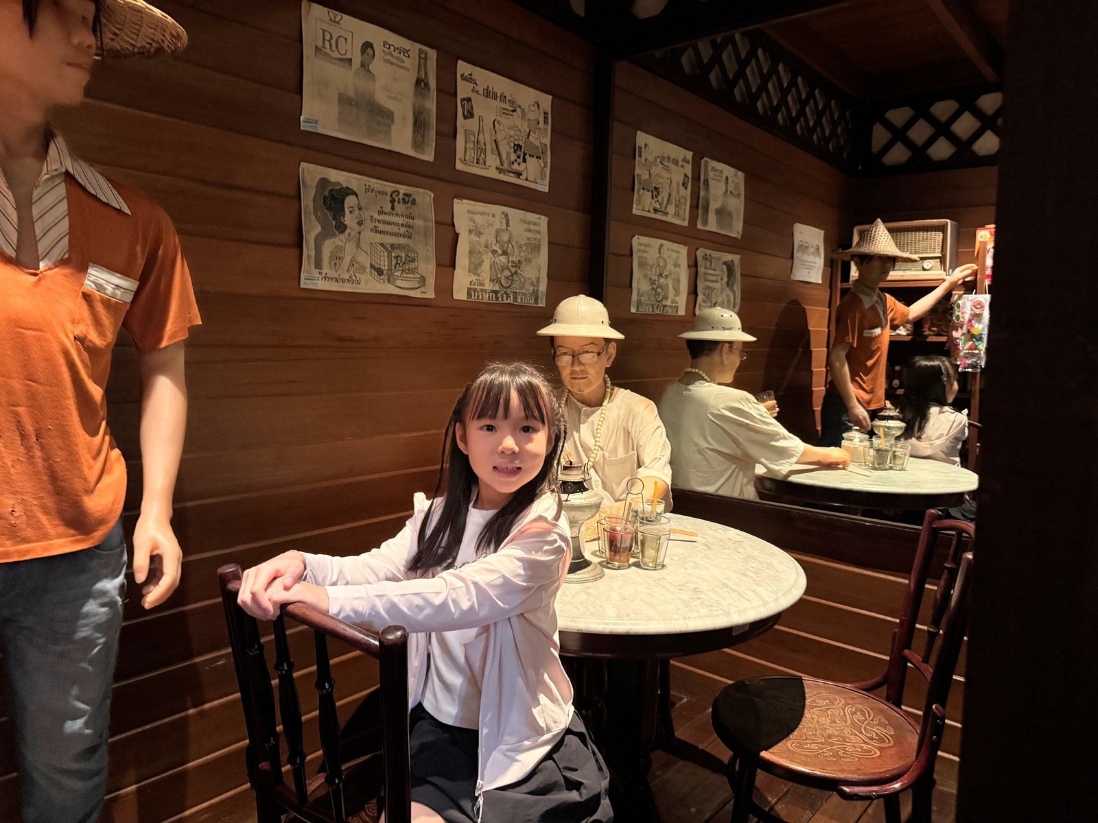 A child exploring the recreated traditional coffee shop