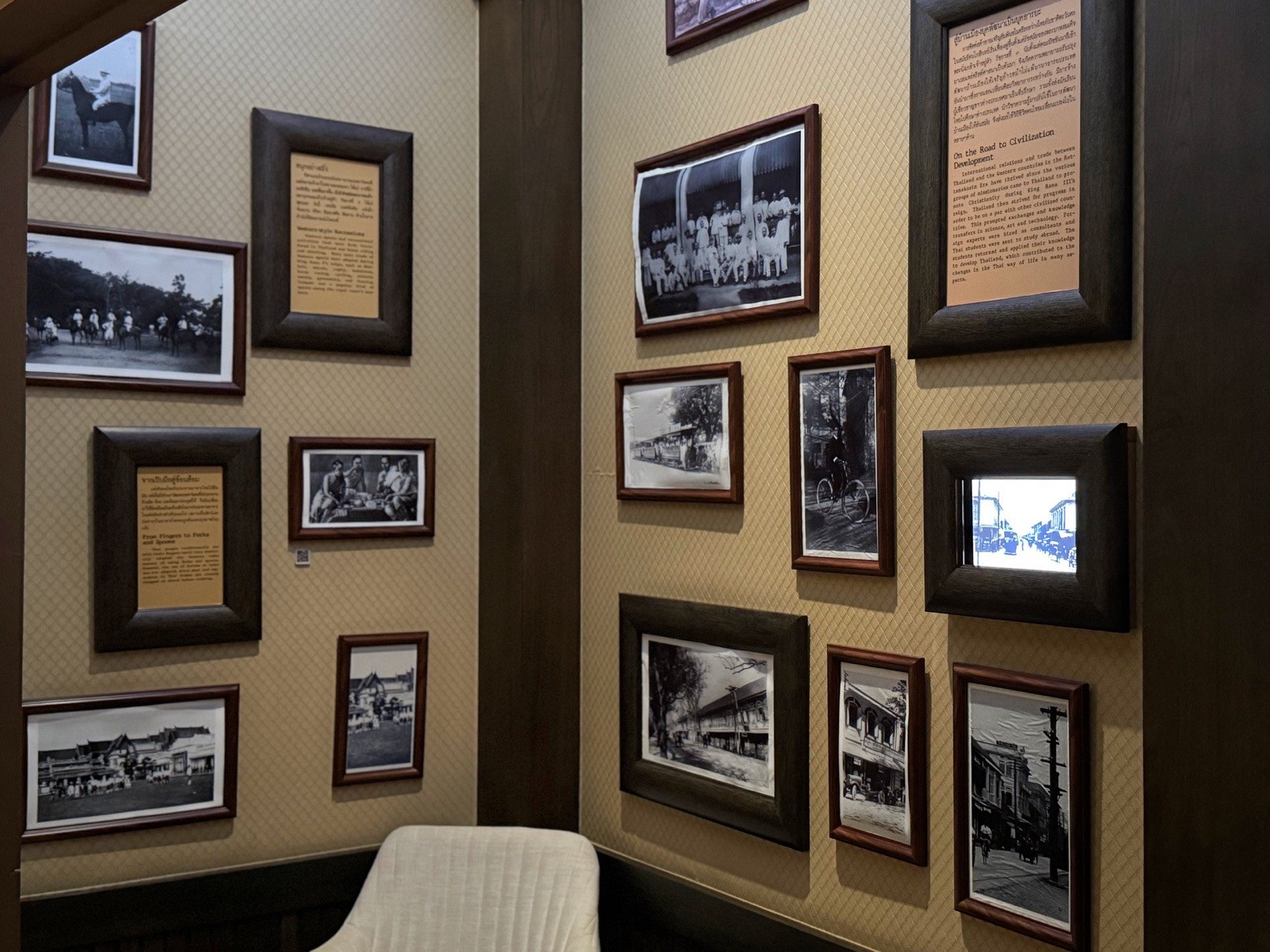 Wall of framed archive photographs of old Bangkok at Rattanakosin Exhibition Hall