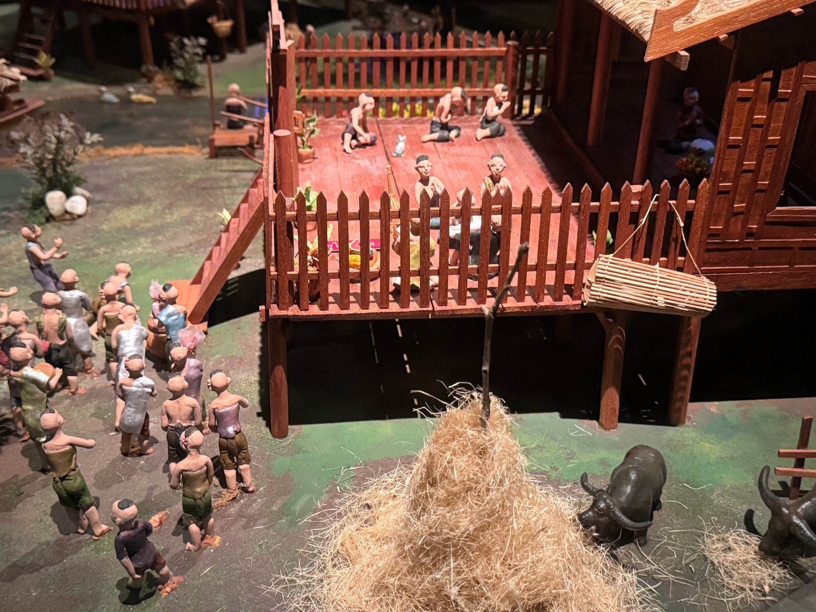 Miniature model of a Thai village gathering at Rattanakosin Exhibition Hall